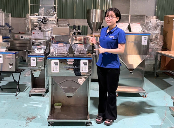 Cân định lượng 1000g 2 đầu cân