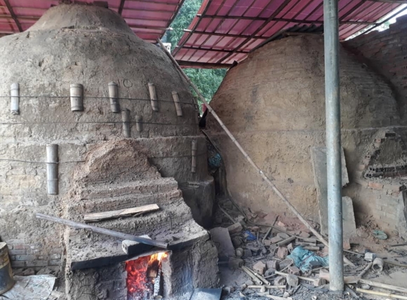Thực hiện quy trình than hóa than hoạt tính bằng lò nung đứng công nghệ cũ